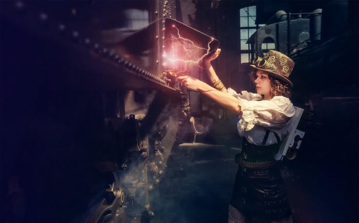 Steampunk woman with goggles and top hat working on machinery