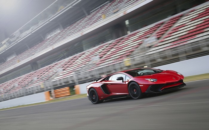 Red Lamborghini Aventador SV on a race track
