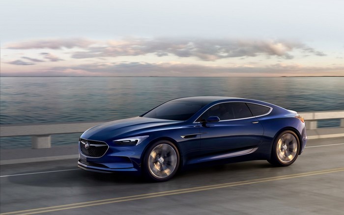 Sleek Blue Buick Avista Driving Along Coastal Road