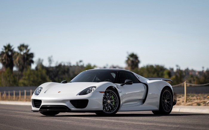 White Porsche 918 Spyder sports car on a road