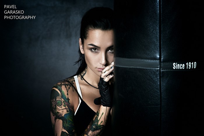 Angelica Anderson posing next to a punching bag