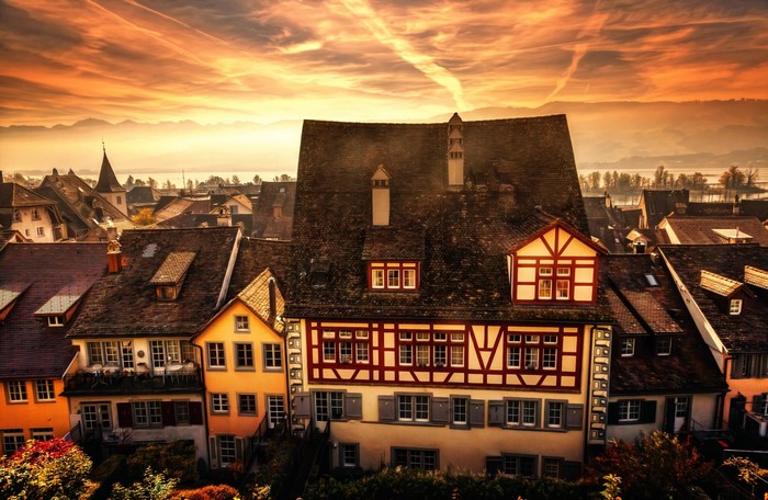 European town with timber-framed houses at sunset