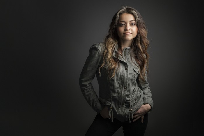 Woman in a jacket posing for a portrait