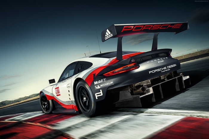 Porsche 911 RSR racing on a track