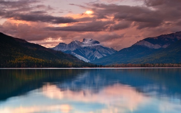 Mountain range reflected in a lake at sunset