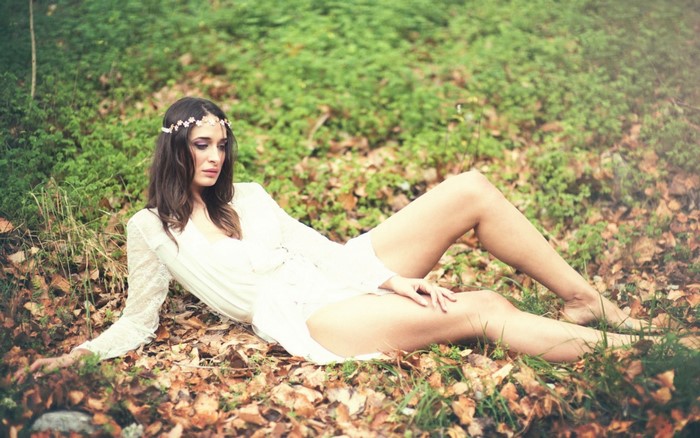 Woman in White Dress Relaxing in Autumn Forest