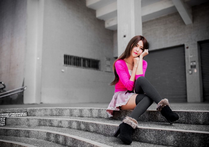 Woman in Pink Top Sitting on Concrete Steps