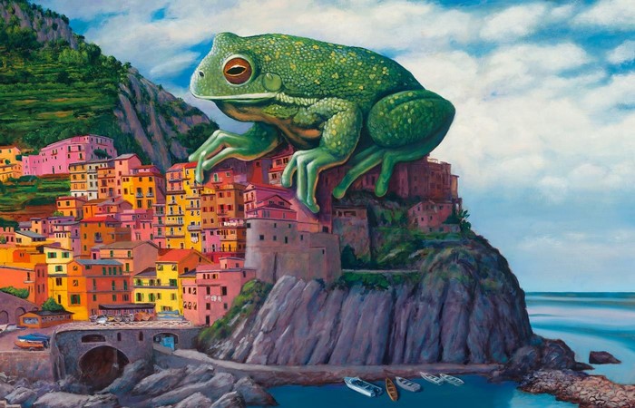 Giant frog perched on a colorful Italian village