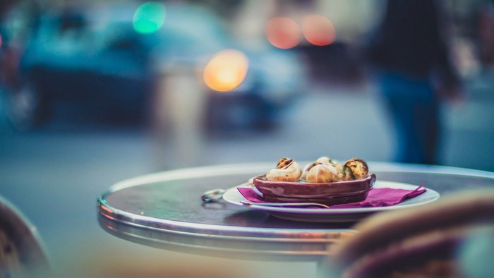 Escargots on a table with bokeh background