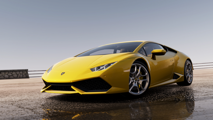 Yellow Lamborghini Huracan on wet road