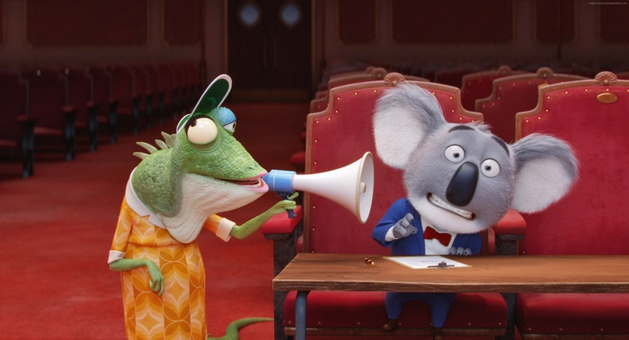 Buster Moon the koala and a lizard in a theater