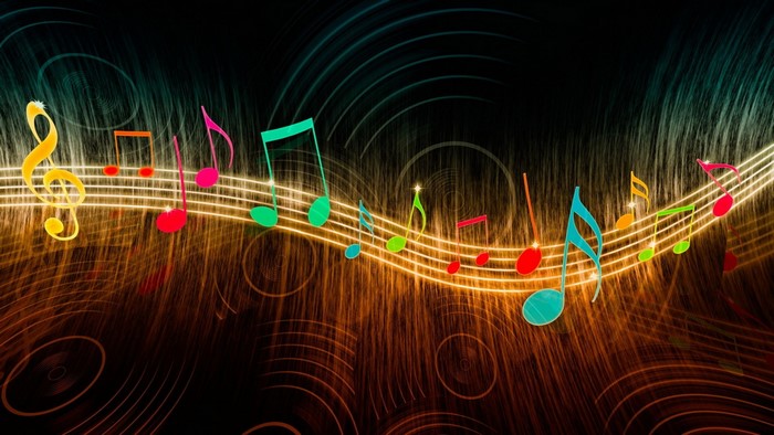 Colorful musical notes on a glowing staff