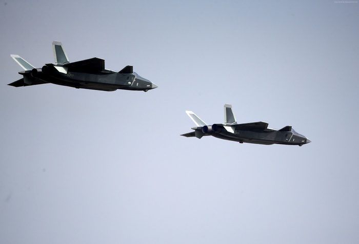 Two Shenyang J-20 fighter aircraft in flight