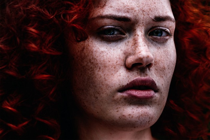 Close up portrait of a redhead woman with freckles