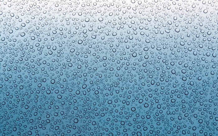 Water drops on a blue surface
