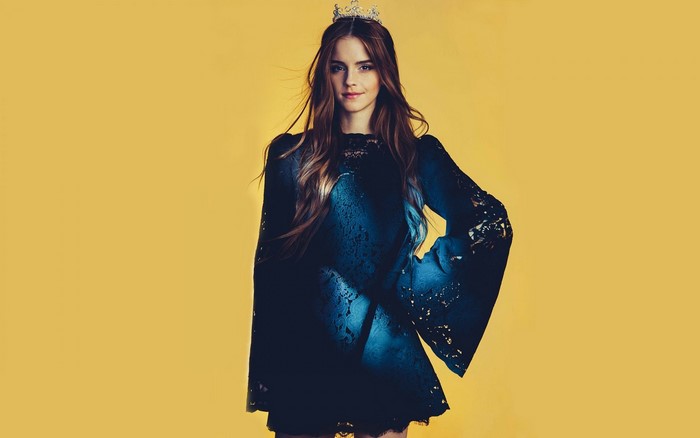 Emma Watson wearing a dark dress and a tiara