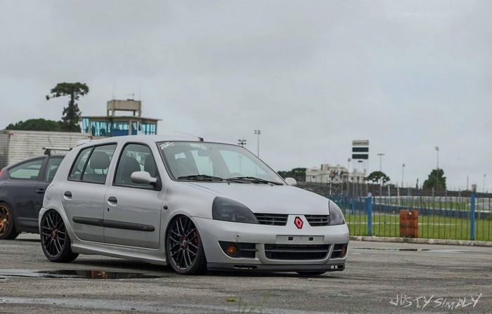 Silver Renault Clio hatchback on a race track