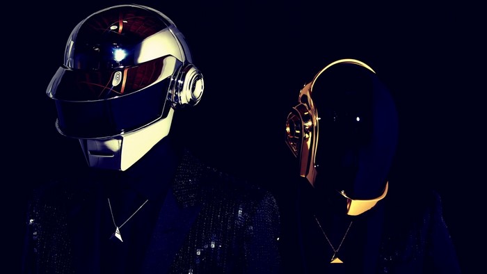Daft Punk duo wearing helmets and suits
