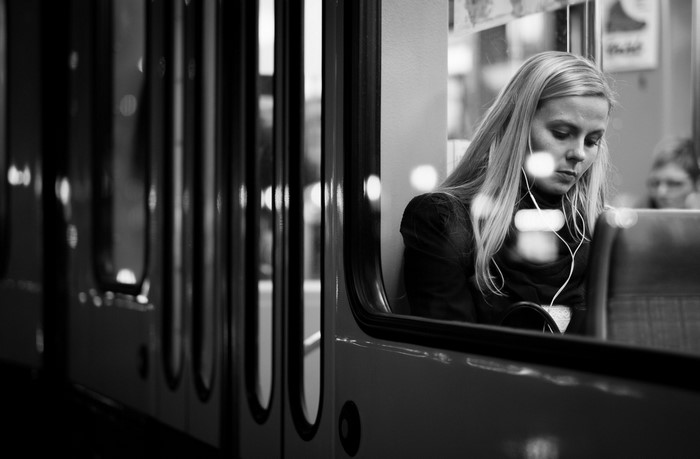 Woman listening to music on a train