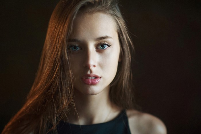 Portrait of a Woman with Blue Eyes and Long Hair