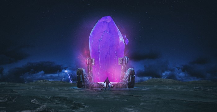 A person stands before a giant glowing purple crystal at night