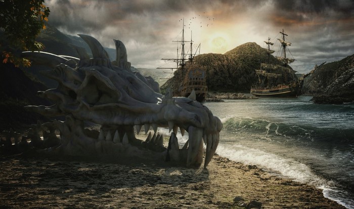 Dragon skull on a beach with pirate ships