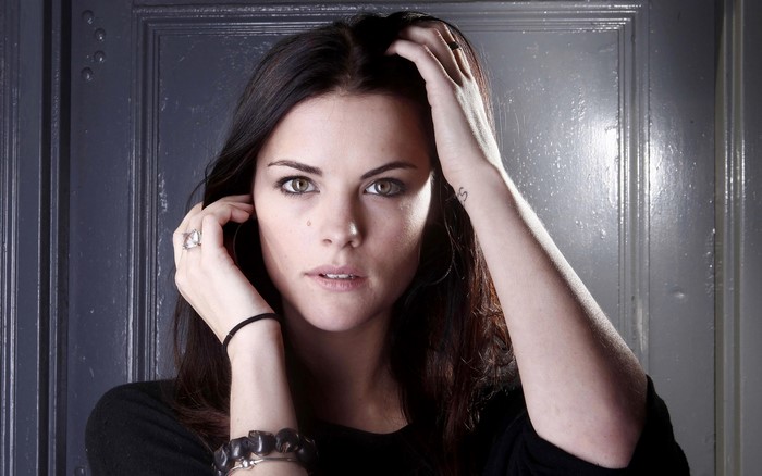 Jaimie Alexander portrait with hands on head
