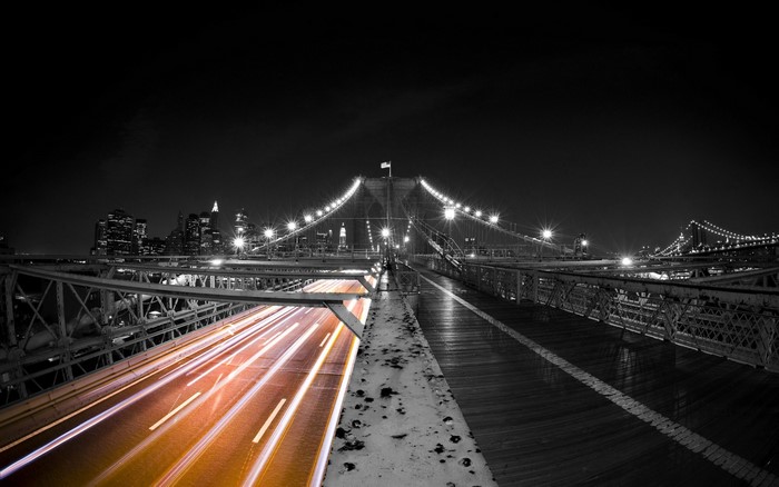 Brooklyn Bridge at Night with Light Trails and Cityscape