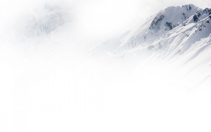 Snowy mountains shrouded in mist