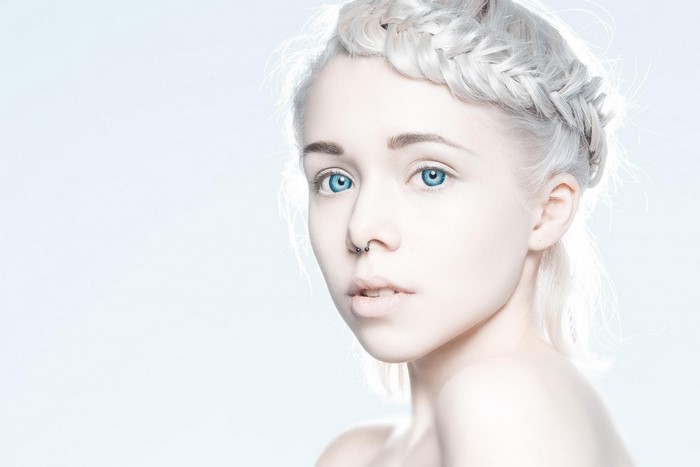 Portrait of Anna Kibanova with blue eyes and braided hair