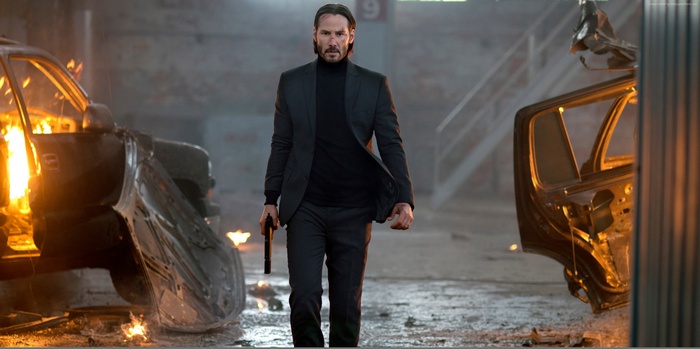 John Wick from John Wick: Chapter 2 with burning cars