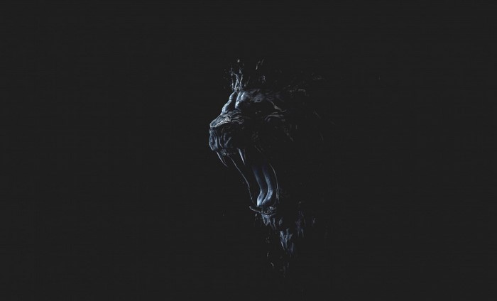 Dark abstract lion head with fangs