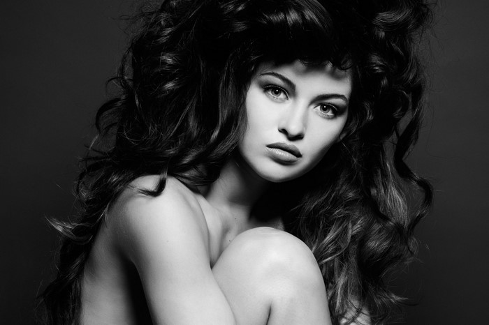 Monochrome portrait of a woman with long dark hair