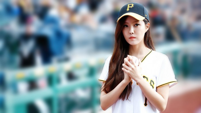 Hyomin from T-ara holding a baseball