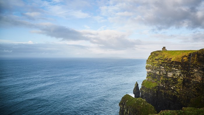 Cliffs of Moher with a tower and the Atlantic Ocean