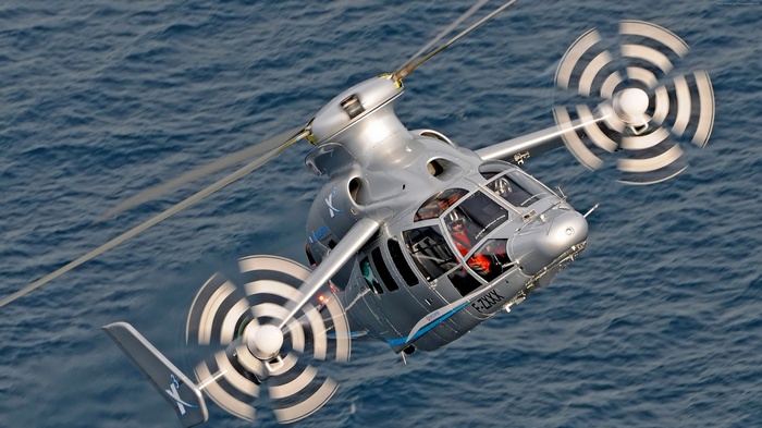 Eurocopter X3 hybrid helicopter flying over the ocean