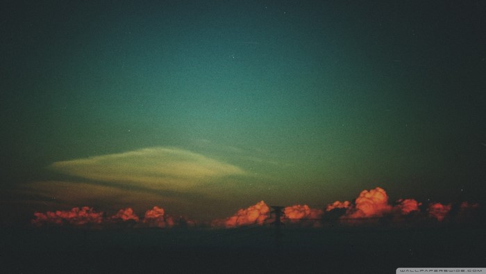 Sunset clouds over the horizon at dusk