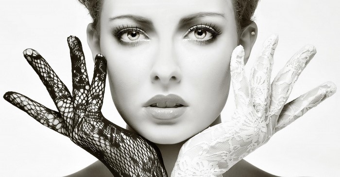 Woman with black and white lace gloves