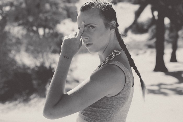 Woman with infinity tattoo and braid