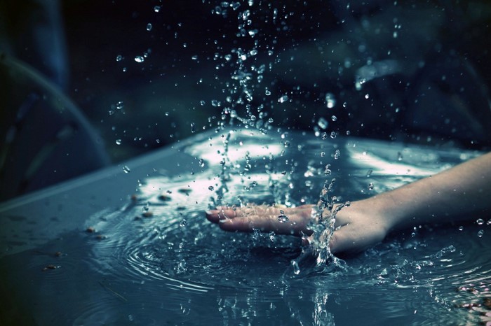Hand splashing water