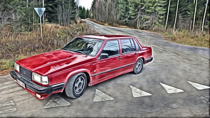 Red Volvo 740 Sedan on a Forest Road