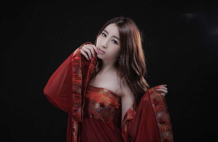 Asian woman in red traditional dress