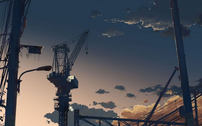 Crane and power lines at sunset
