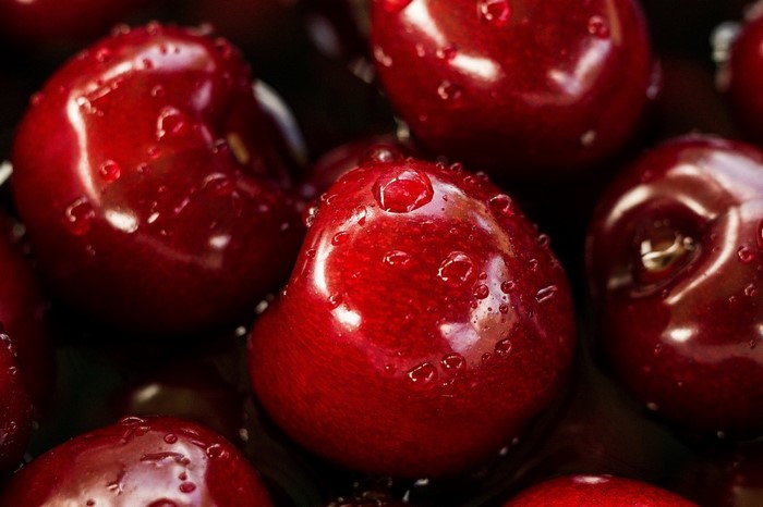 Close-up of fresh cherries with water droplets