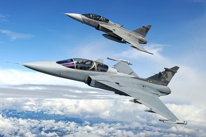 Two Saab JAS 39 Gripen fighter aircraft in flight
