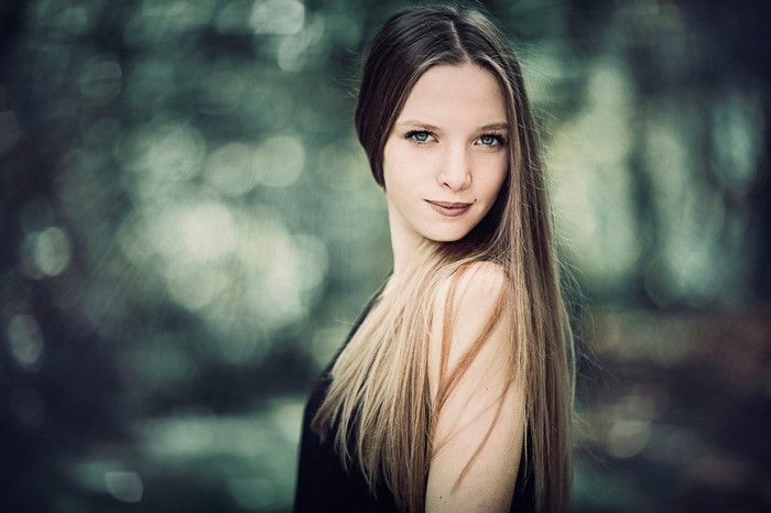 Portrait of a young woman with long brown hair