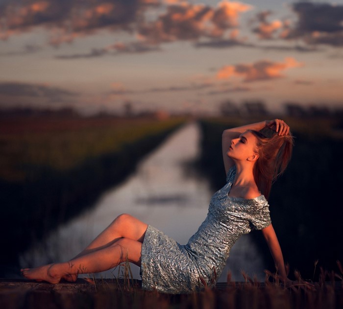 Woman in dress at sunset