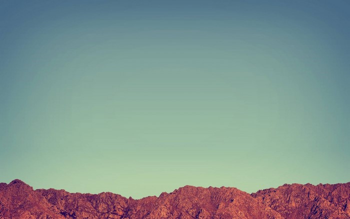 Rocky mountain range under a clear sky