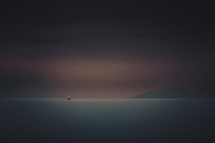 Sailboat on the sea at dusk