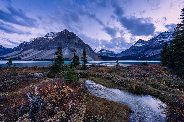 Mountain range with lake and stream in autumn